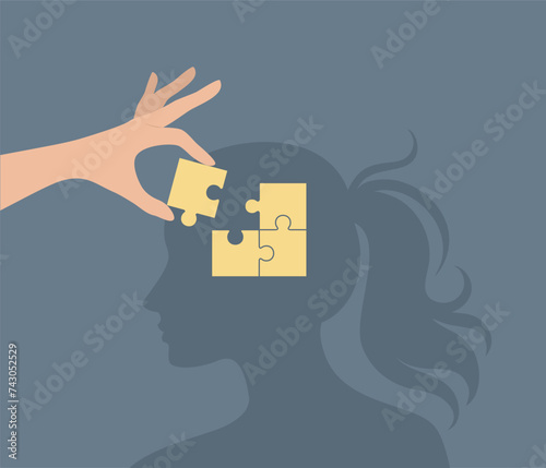 A hand placing the last piece of a puzzle into a woman's head. The concept of psychological help and support. Flat vector illustration