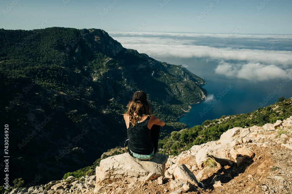 Hiking on Lycian way. Woman with backpack is trekking in beautiful nature Hiking on Lycian way. Woman with backpack is trekking in beautiful nature