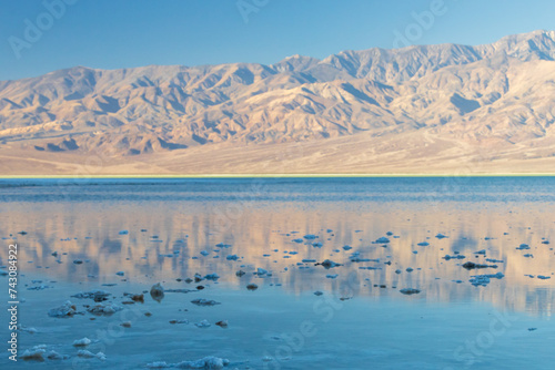 Lake Manly and salt flats at Badwater Basin in Death Valley National Park, California photo
