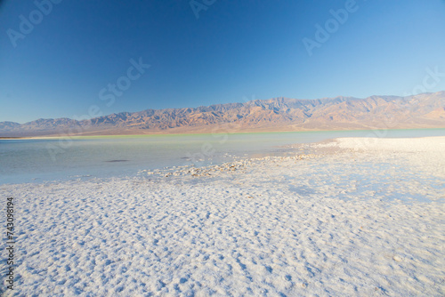 Lake Manly and salt flats at Badwater Basin in Death Valley National Park  California
