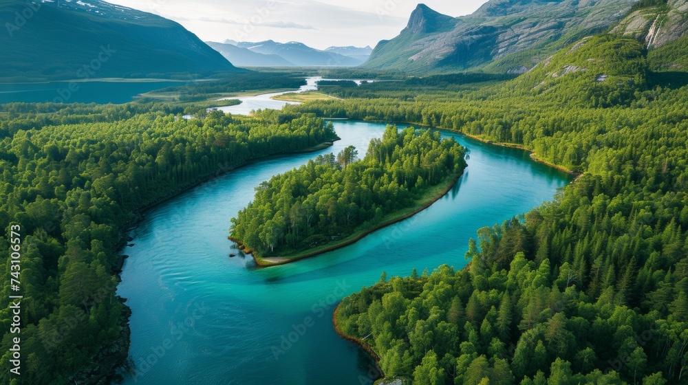 Aerial View of a Serpentine Turquoise River Flowing Through Pine Forests with Mountain Peaks in the Background, Innlandet County, Norway