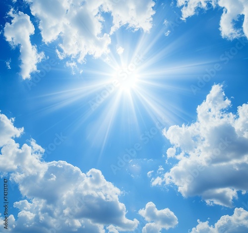 Radiant Sunburst in Blue Sky with Fluffy White Clouds - Perfect for Summer Day Background