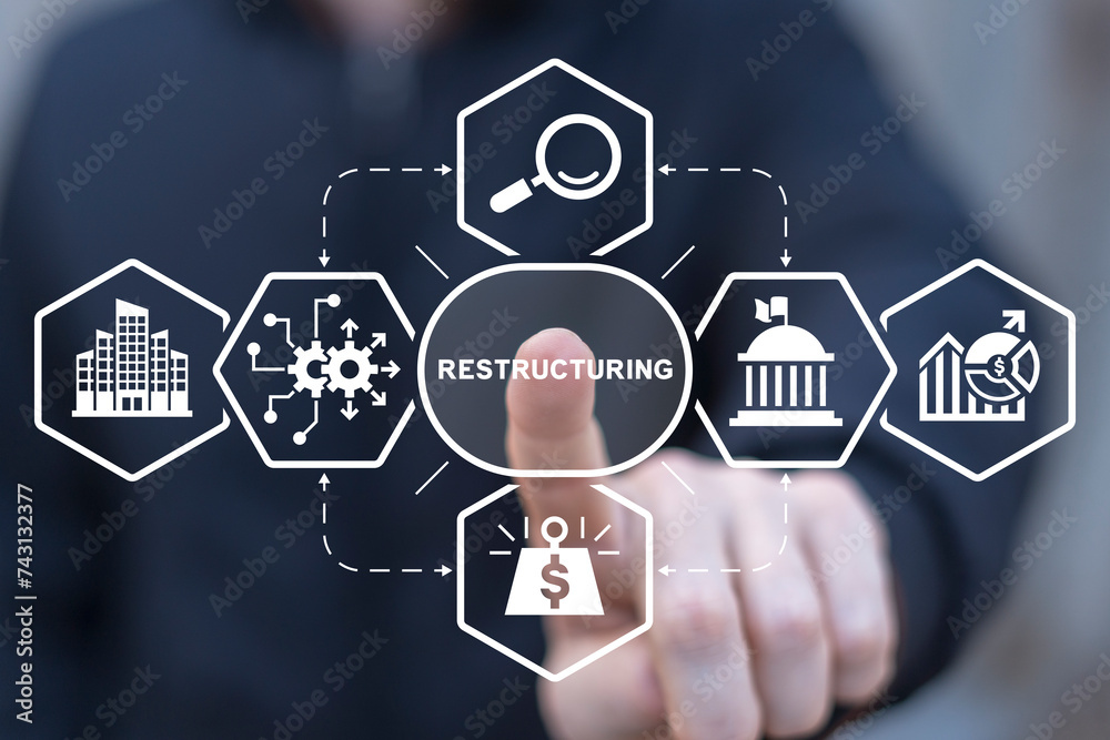 Man using virtual screen clicks text: RESTRUCTURING. Restructuring business and making company profitable concept. From loss to success. Avoid losses, make a profit. Increase efficiency, reduce costs. Man using virtual screen clicks text: RESTRUCTURING. Restructuring business and making company profitable concept. From loss to success. Avoid losses, make a profit. Increase efficiency, reduce costs.