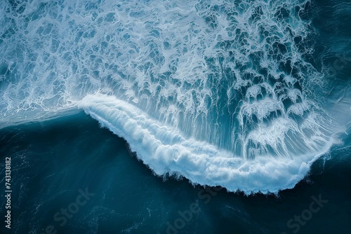 Aerial view of majestic ocean waves crashing in deep blue seascape