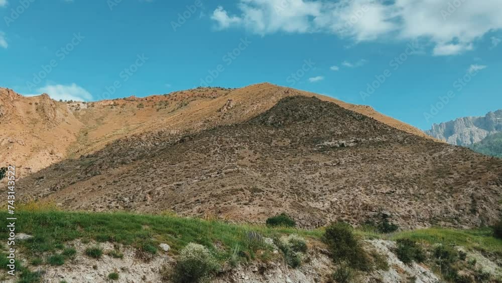 Mountain landscape of the Fan Mountains on a sunny summer day, Tajikistan, Central Asia. Fan Mountains in the heart of Tajikistan. 4K Mountain landscape of the Fan Mountains on a sunny summer day, Tajikistan, Central Asia. Fan Mountains in the heart of Tajikistan. 4K