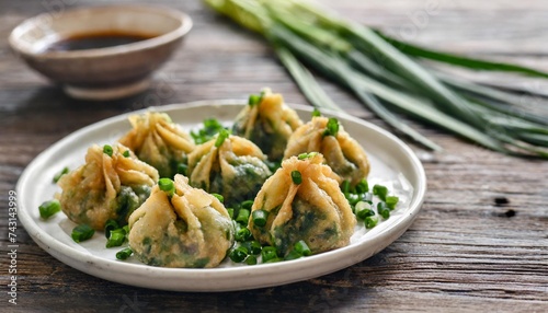 deep fried chinese chive dumplings kanom gui chai or ku chai kuih make for a great healthy and light snack appetizer and consisting of chinese chives stuffed inside dumpling dough photo