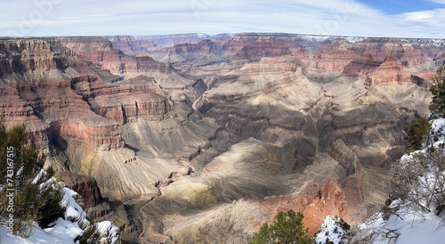 The massive Grand Canyon in the shadows of the clouds