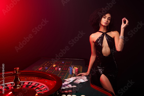 Photo of chic girl croupier in poker private club announce professional shark about winning holdem wager jackpot photo