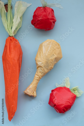 Sculpted plastic food items on blue backdrop photo