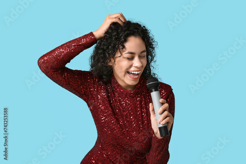 Joyful woman singing karaok...
