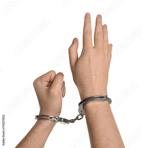Freedom concept. Man with handcuffs on his hands against white background, closeup