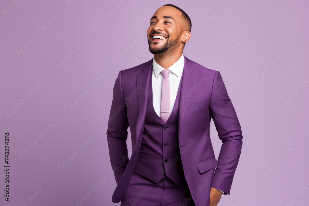 Handsome african american man in violet suit on violet background Handsome african american man in violet suit on violet background