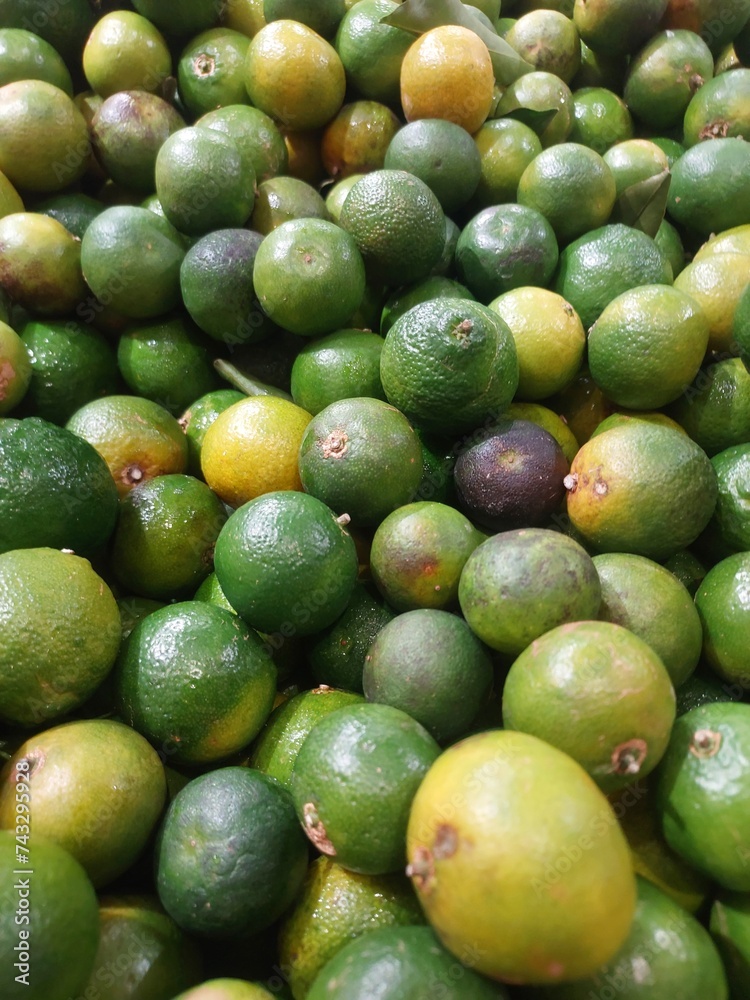Lime Citrus Fruits In Fruit Market. Natural fresh limes. Lime Citrus Fruits In Fruit Market. Natural fresh limes.