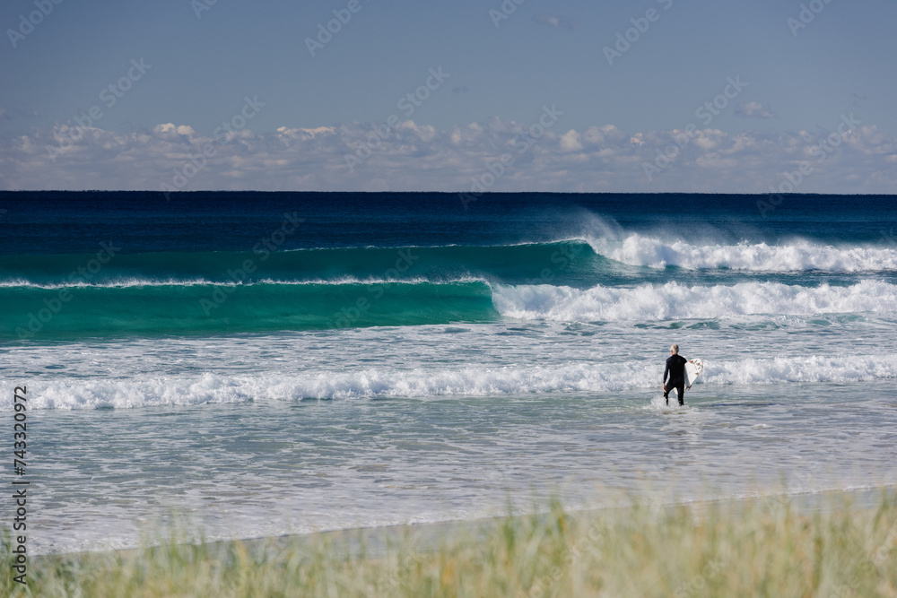 Casuarina Beach Winter Surf: Crisp Offshore Waves under Blue Skies