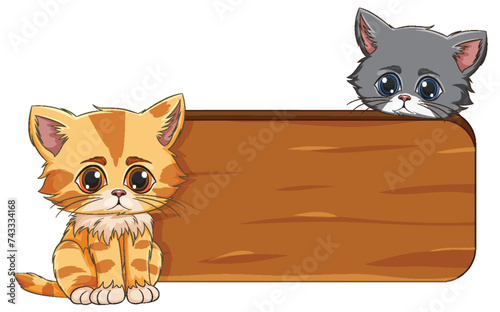 Two adorable kittens beside a wooden sign.