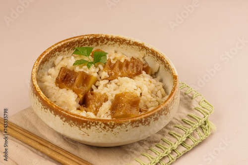 Takenoko Gohan or Bamboo Rice is a Simple Rice Dish Cooked in Dashi Broth with the Addition of Tender Bamboo Shoots. photo