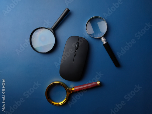 Top view magnifying glass and wireless mouse
