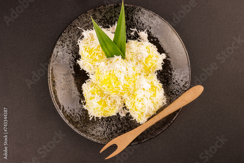 Pichi-Pichi or Pitsi-Pitsi is a Filipino Dessert made from Steamed Cassava Mixed with Sugar and Lye Water. photo