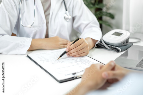 Female doctors who treat patients make an appointment to listen to the results after a physical examination explain medical information and diagnose the disease. Medical concepts and good health