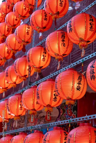 Riufang, Taiwan, 13 february 2024. Rows of chinese red lanterns inside the city temple. Religion symbol. photo