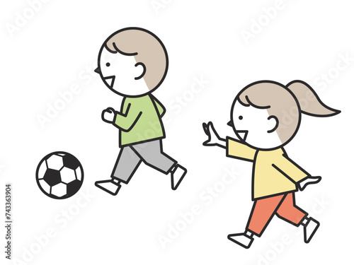 楽しそうにサッカーをする子供たち