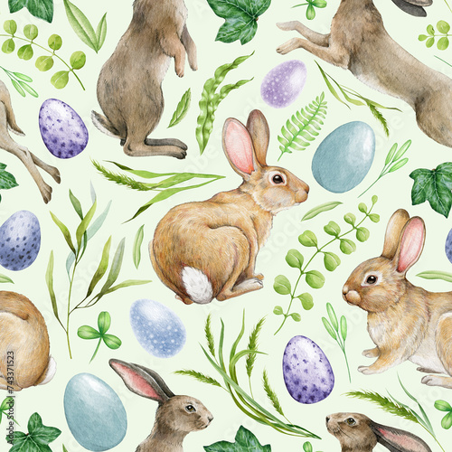 Bunny Easter decor seamless pattern. Watercolor illustration. Hand drawn cute bunnies, painted eggs, green leaves, herbs. Easter festive decoration with rabbits and greens. Springtime lush decor