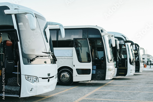 Row Of Tourist Buses at Parking Lot  photo