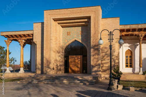 View of the administrative building on the territory of the Bahauddin Naqshbandi Memorial Complex and Museum on a sunny day, Bukhara, Uzbekistan photo