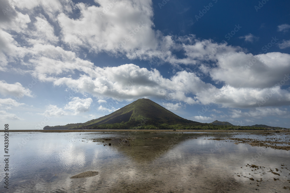 Gunung Api volcano and coast at low tide in Bandaneira, Banda islands, Maluku