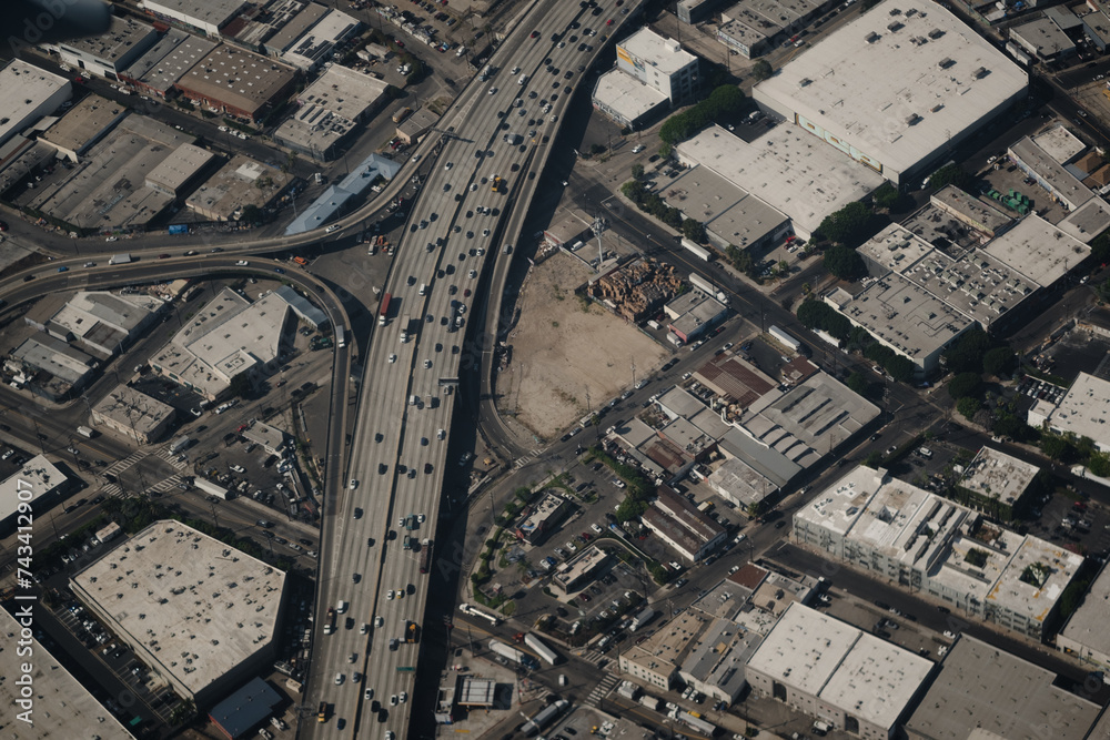 The 10 Freeway cuts through the Fashion District of Los Angeles, near the Alameda St exit. The aerial view shows the 