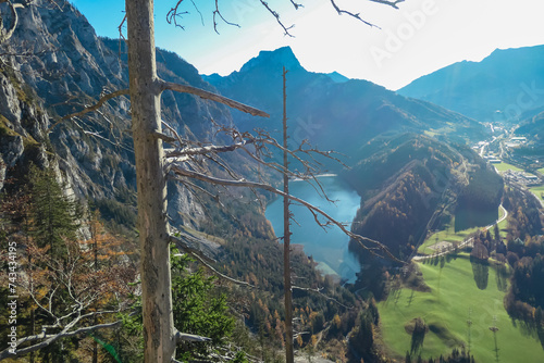 Panoramic aerial view of alpine lake Leopoldsteinersee in Eisenerz, Styria, Austria. Looking at majestic mountain peaks of Eisenerzer massif. Wanderlust in remote Austrian Alps. Idyllic hiking trail photo