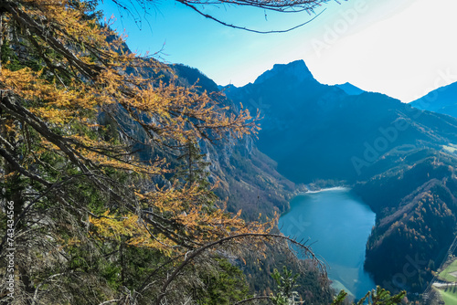 Panoramic aerial view of alpine lake Leopoldsteinersee in Eisenerz, Styria, Austria. Looking at majestic mountain peaks of Eisenerzer massif. Wanderlust in remote Austrian Alps. Idyllic hiking trail photo