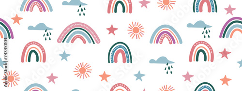 Seamless pattern with hand drawn rainbows, sun, clouds and stars.
