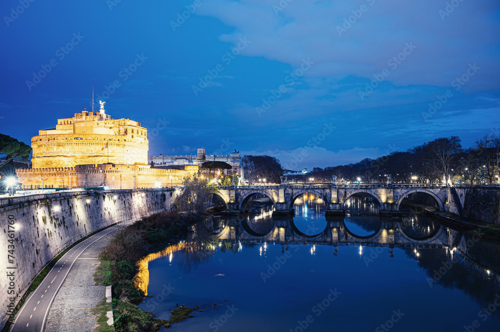 St. Angelo castle and bridge at night in Rome, Italy