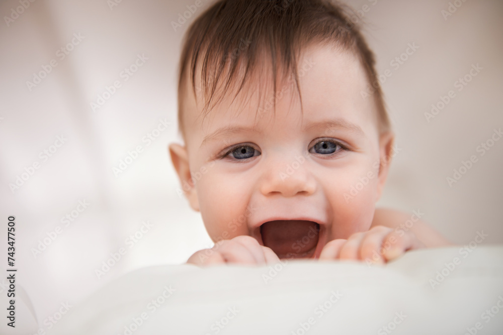 Baby boy, excited smile and happy for play, growth and development for childhood. Adorable infant, young and healthy kid at home with face expression, learning motor skills and comfortable in house Baby boy, excited smile and happy for play, growth and development for childhood. Adorable infant, young and healthy kid at home with face expression, learning motor skills and comfortable in house