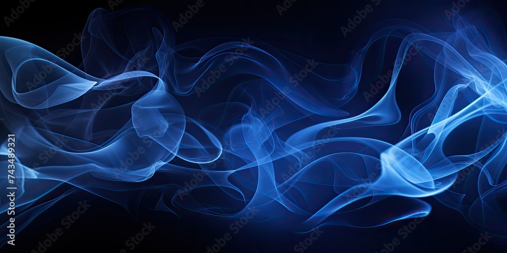Blue smoke abstract on a black background embodies the concept of darkness with an intriguing twist. The wisps of blue smoke, delicately swirling and intertwining against 