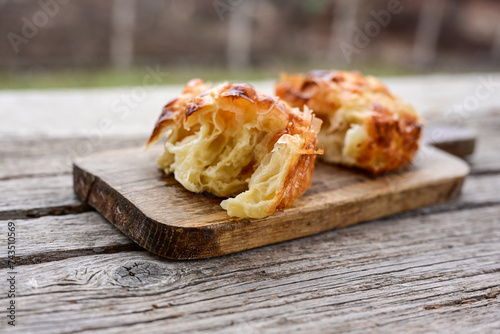 Bakery .Home made  cheese pie  with phyllo pastry and organic eggs. Bulgarian banitsa photo