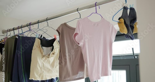 Dry laundry clothes and hanging up in indoor