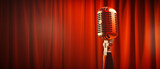 Retro microphone on stage with red curtain background.