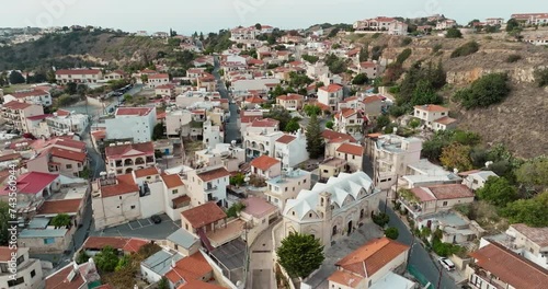 Aerial view Pissouri village Cyprus. Architecture of mountain areas with houses with red roofs and a beautiful cityscape of the Mediterranean island. High quality 4k footage photo