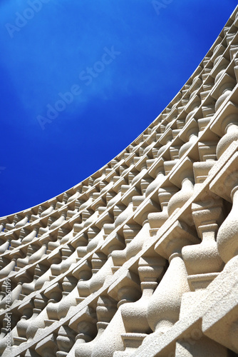 Wall decoration consist of balustrade.Sand spray texture and many shape turn around for interesting.Many stories.Background blue sky.