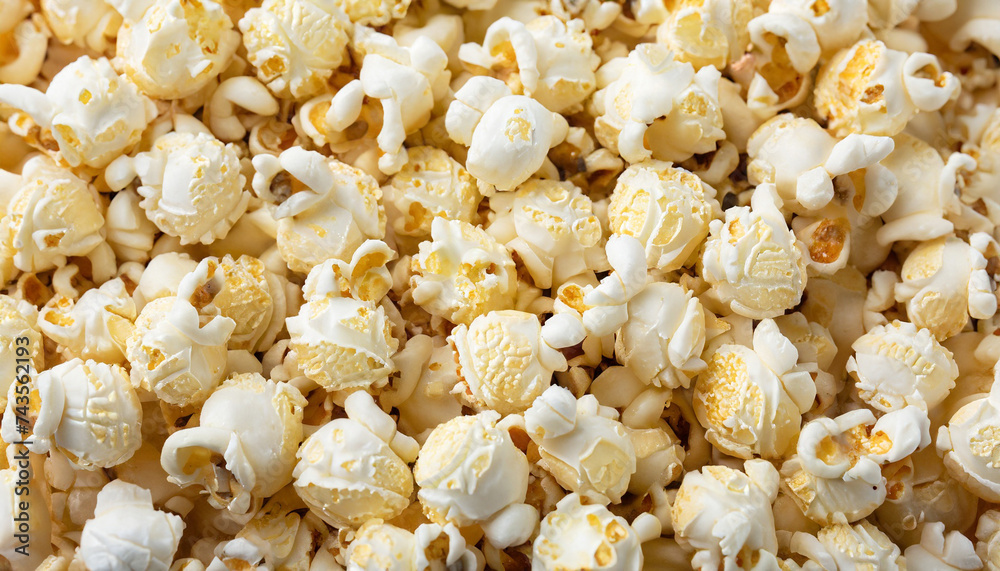 Scattered salted popcorn, texture background. Scattered salted popcorn, texture background.