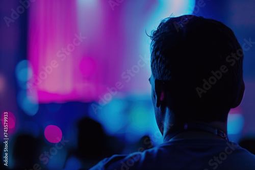 A person watching on a screen in a dark room. A slide background for showcasing digital content. Background image. Created with Generative AI technology. © Artem