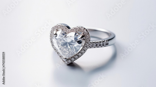 Heart Shaped Diamond Ring on White Surface