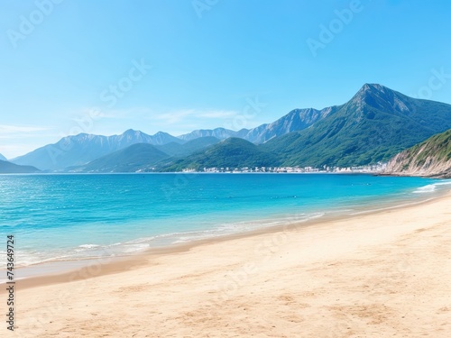 Beach with mountains and sea in the summertime