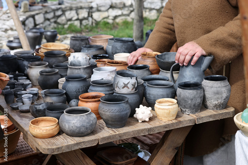  Handmade imitations of medieval ceramic vessels in knight camp at the festival of historical reconstruction photo