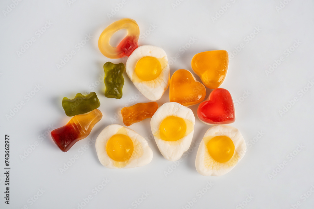 Colorful candies, jelly and marmalade on white background. Top view