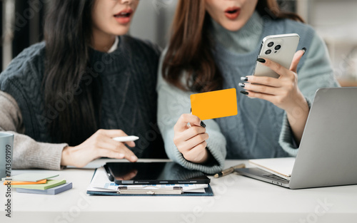 Business woman use credit card to shopping online in internet website shop with computer laptop on work table in office.