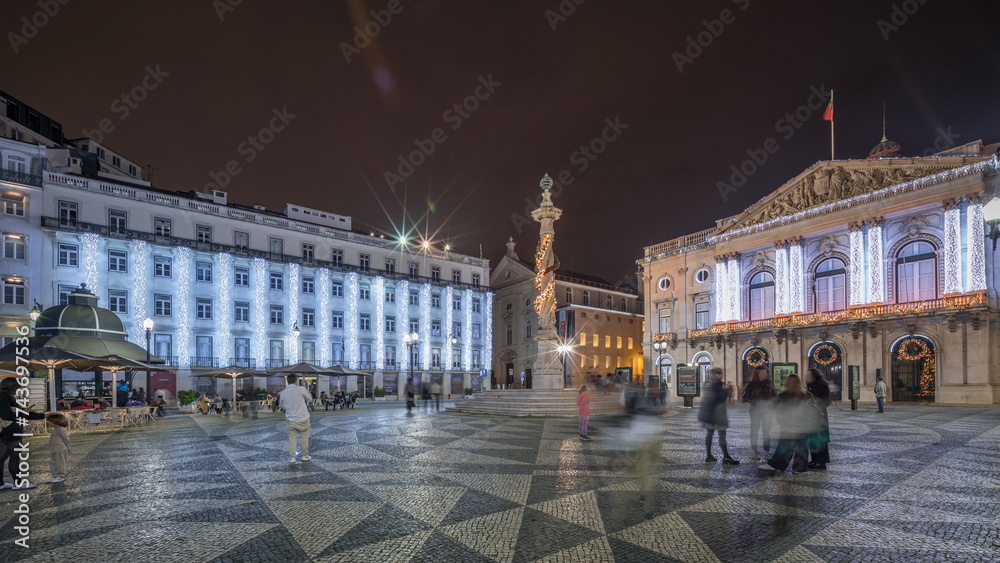Panorama showing Municipal square with City Hall architecture decorated for Christmas and night celebrations night timelapse. Lisbon, Portugal