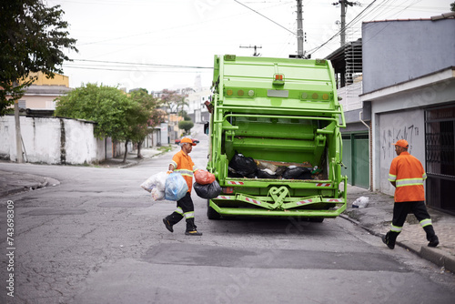 Fotografie Garbage truck, junk and men with collection service on street in city for public environment cleaning